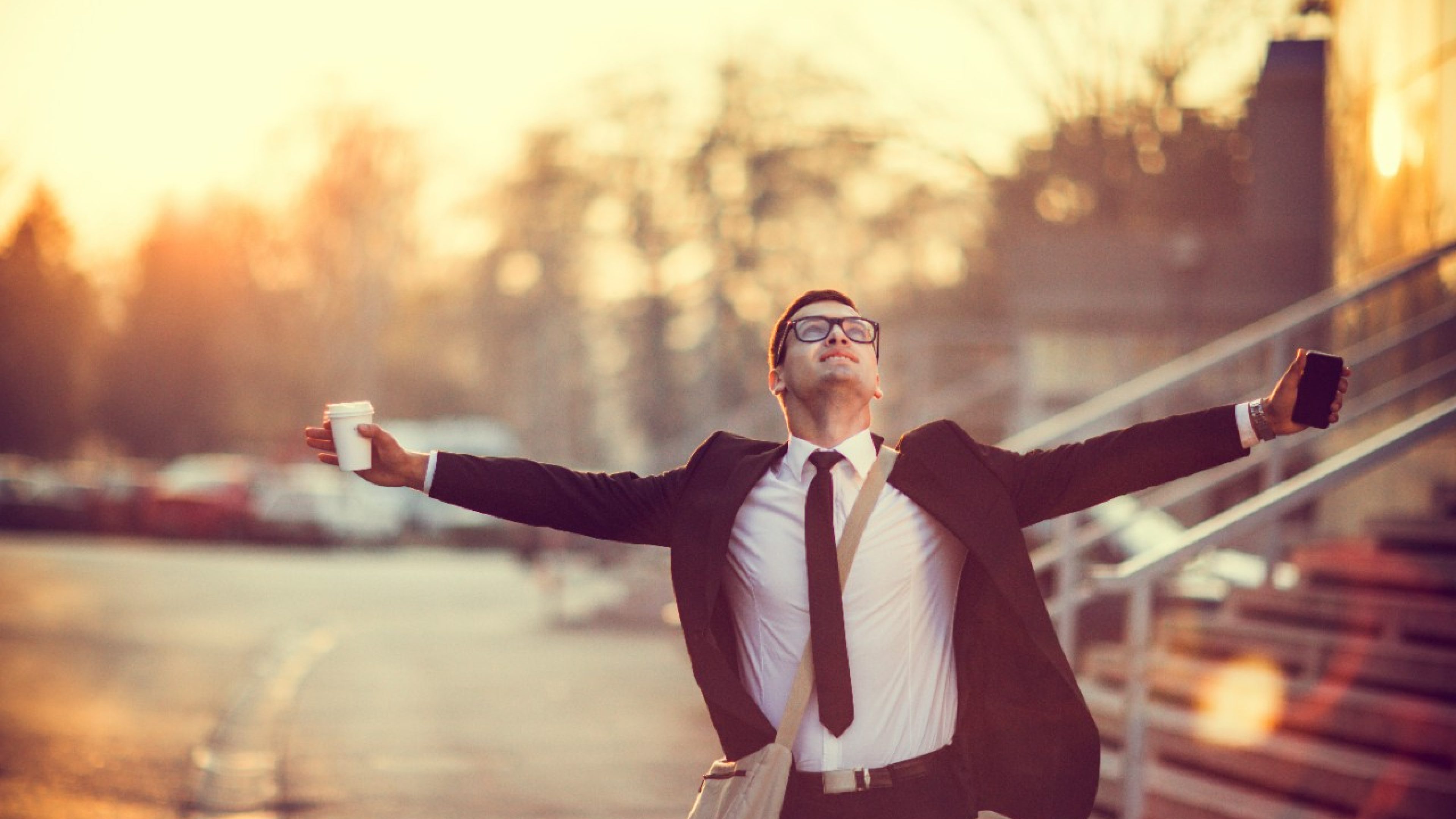 Businessman smiling with arms outstretched